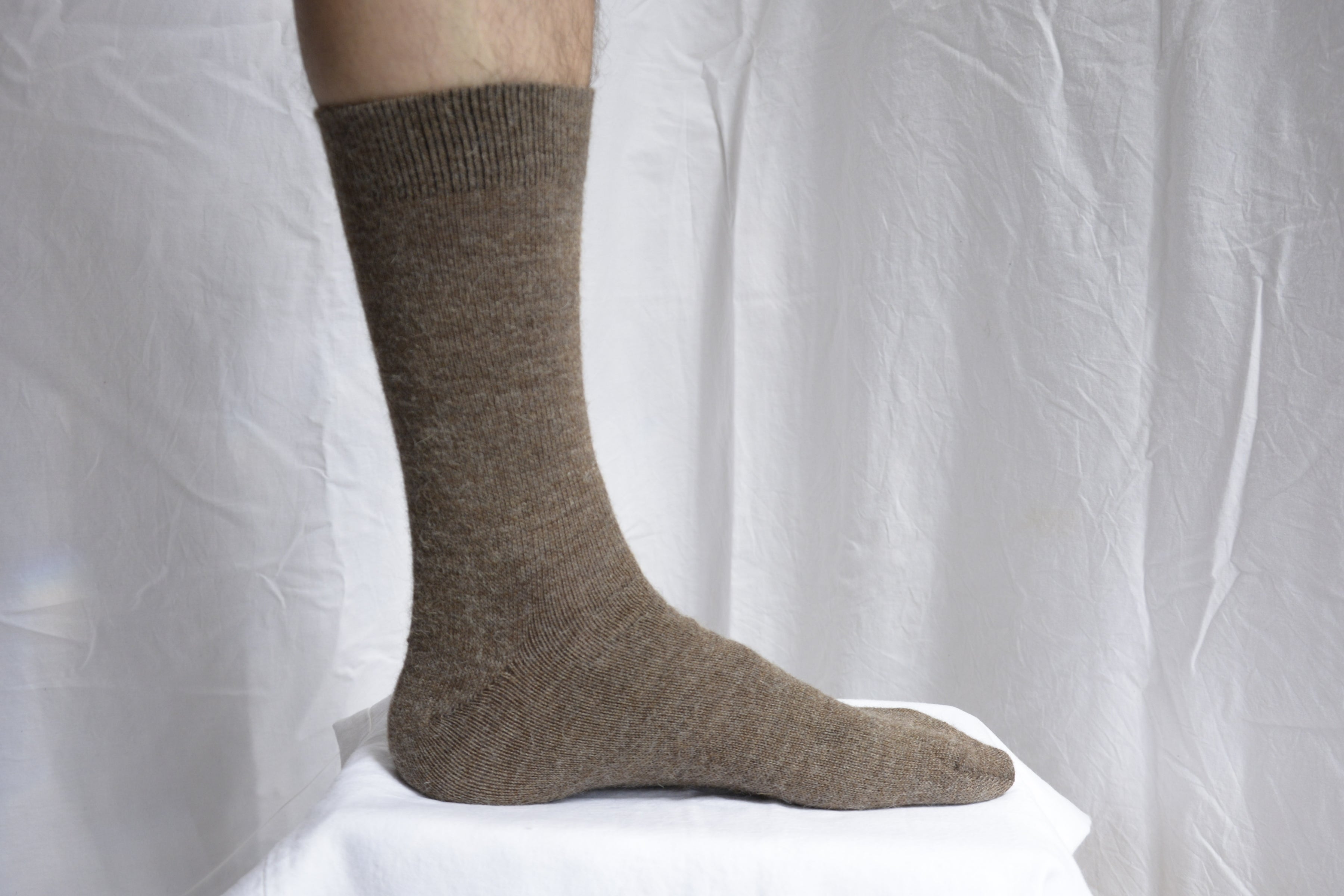 Alpaca_wool_clothing_Peru_foot_with_coffee_sock