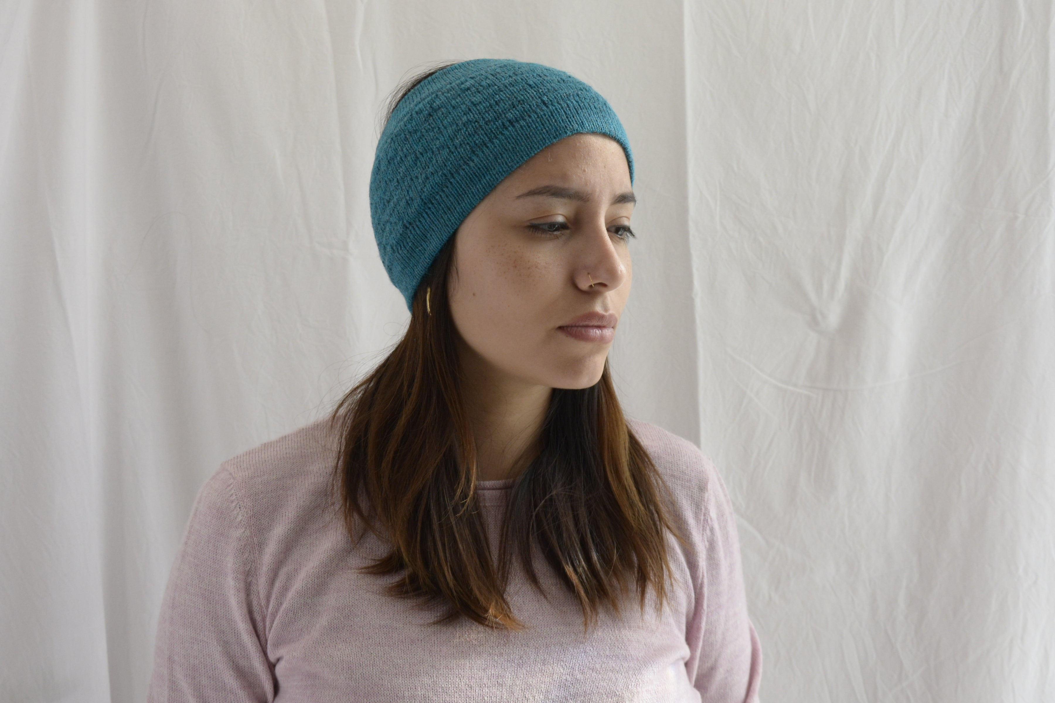 Woman_wearing_aqua_blue_head_band_peruvian_wool