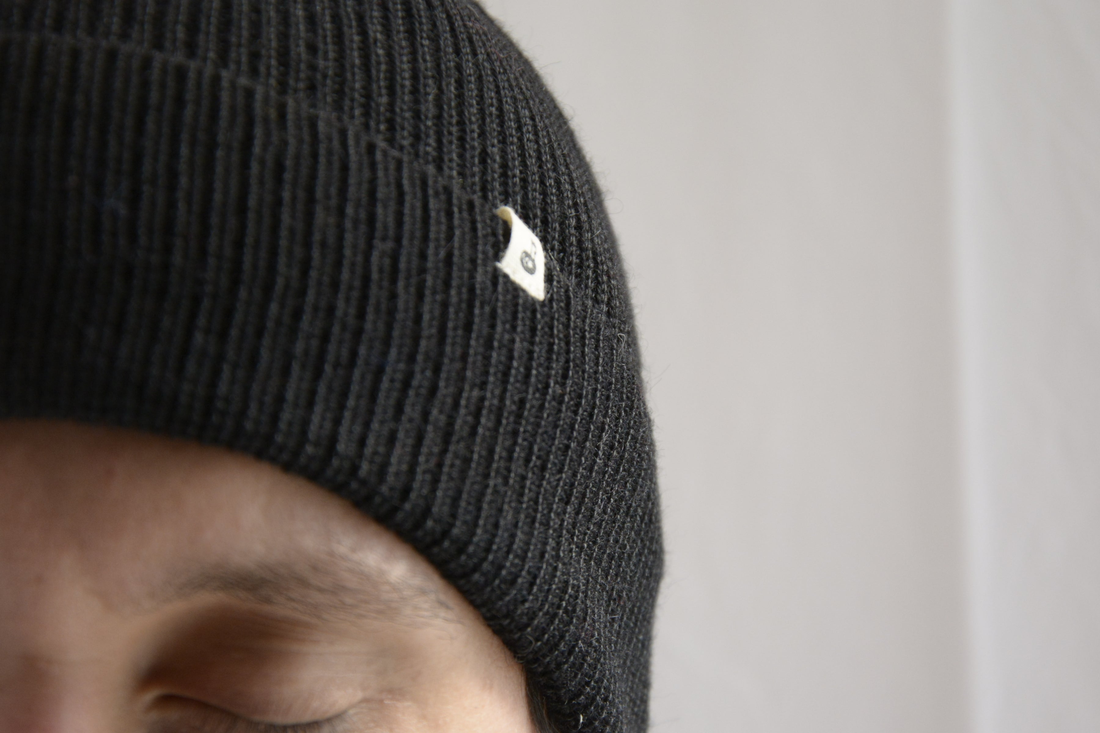 Man_wearing_black_peruvian_wool_beanie