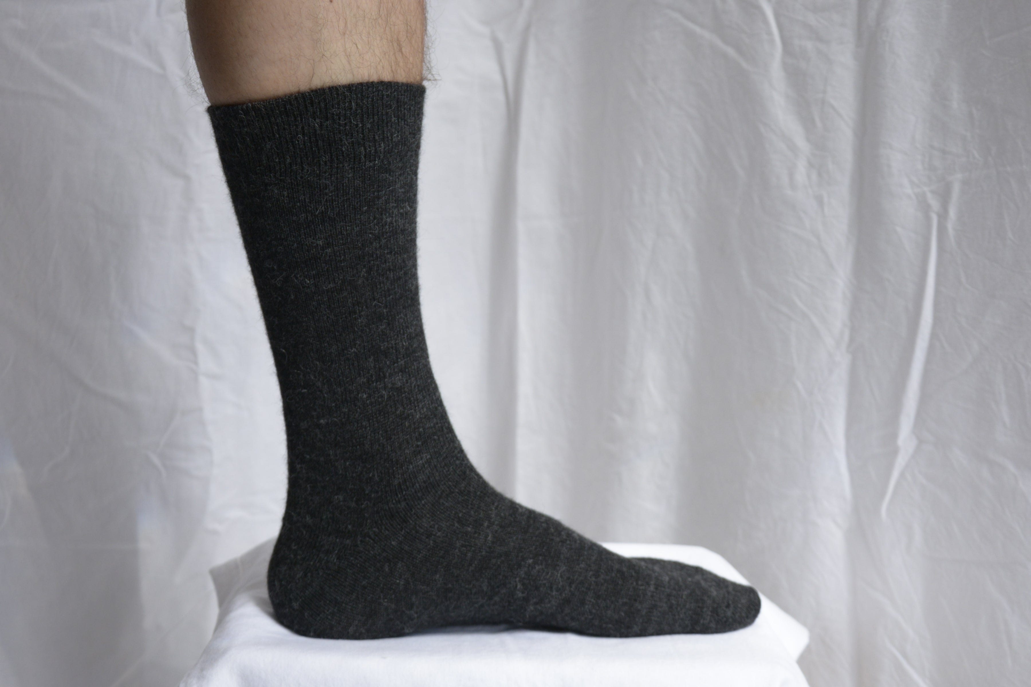 Alpaca_wool_clothing_Peru_foot_with_black_sock