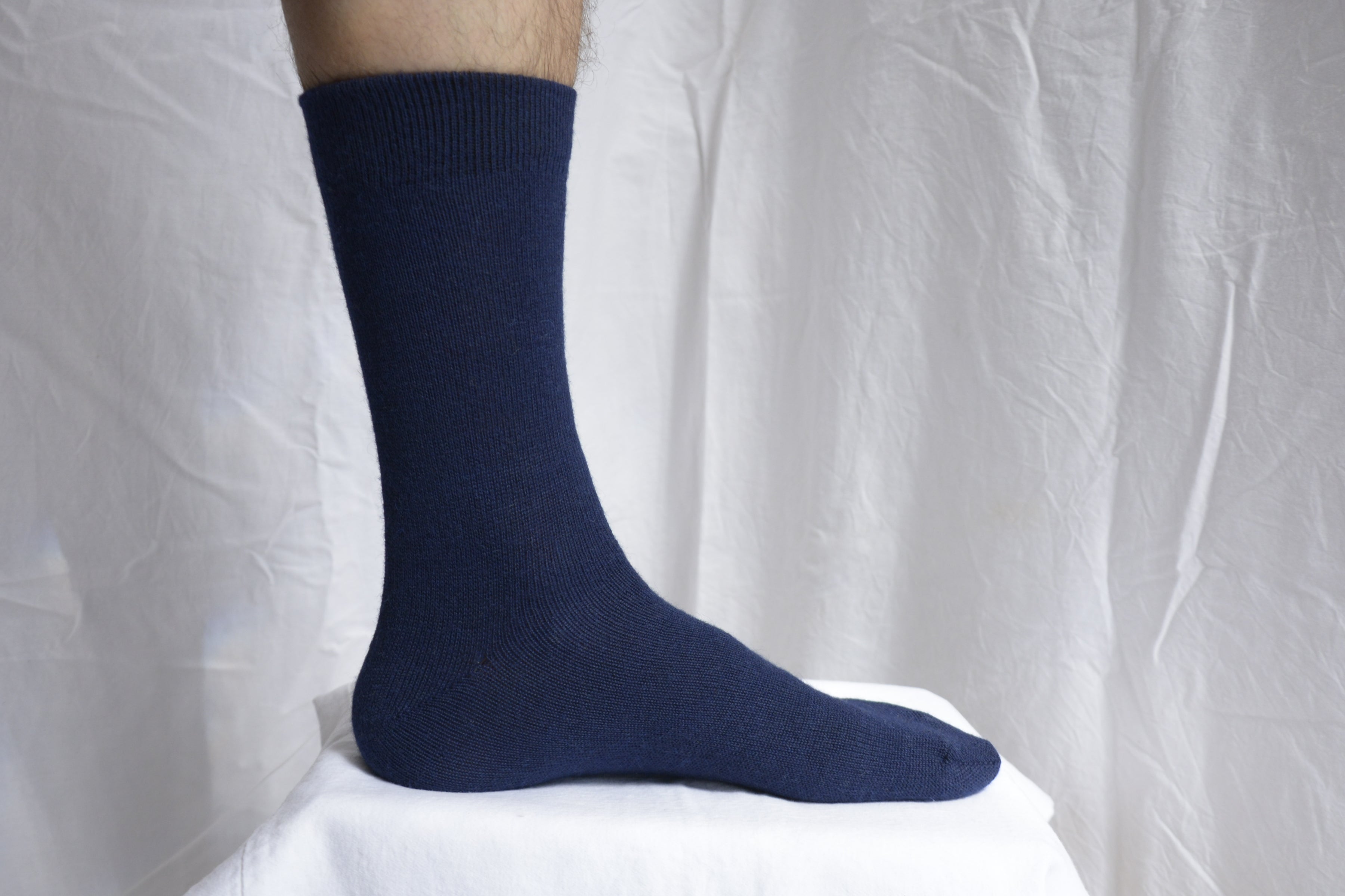 Alpaca_wool_clothing_Peru_foot_with_blue_sock