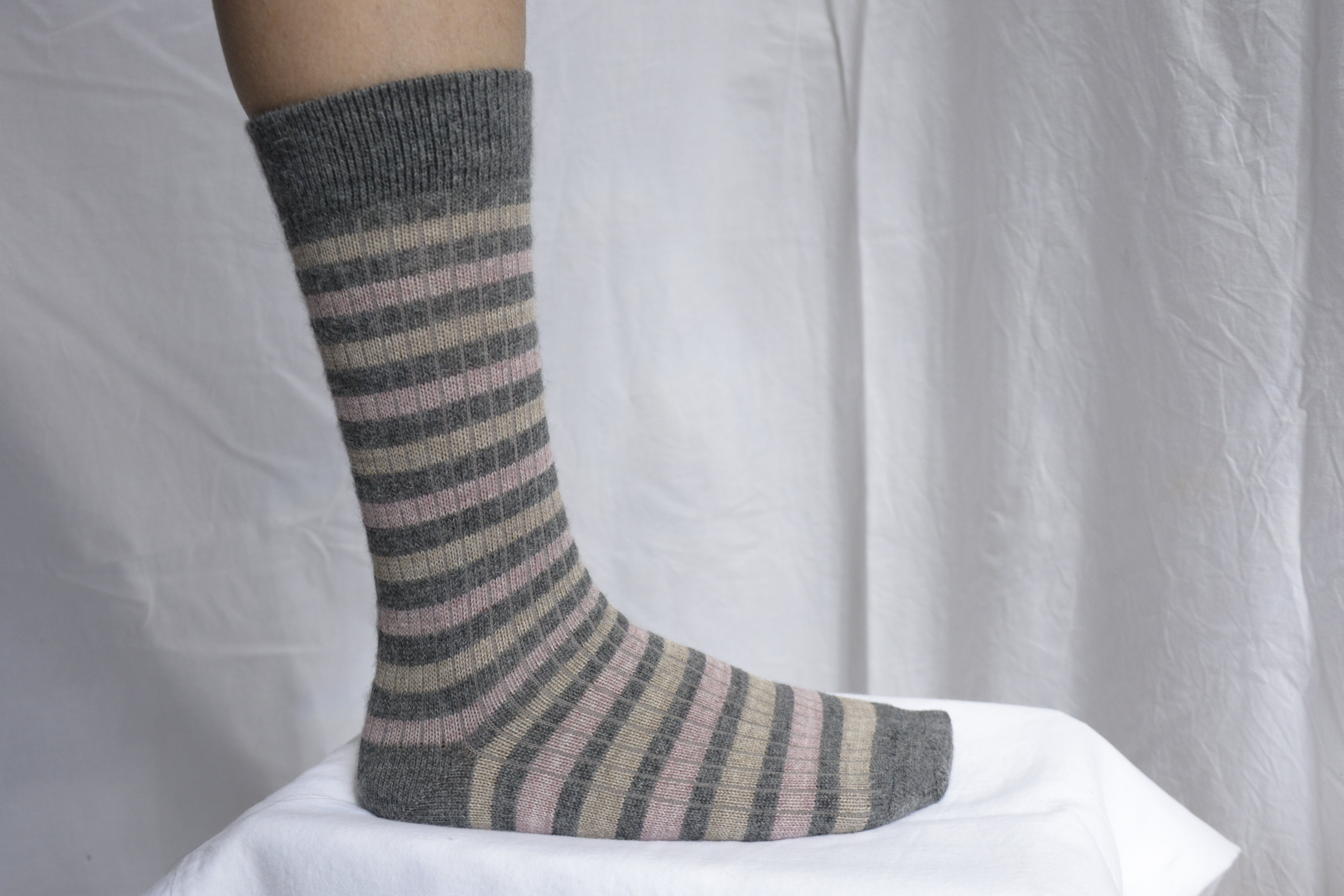 Alpaca_wool_clothing_Peru_foot_with_light_gray_sock