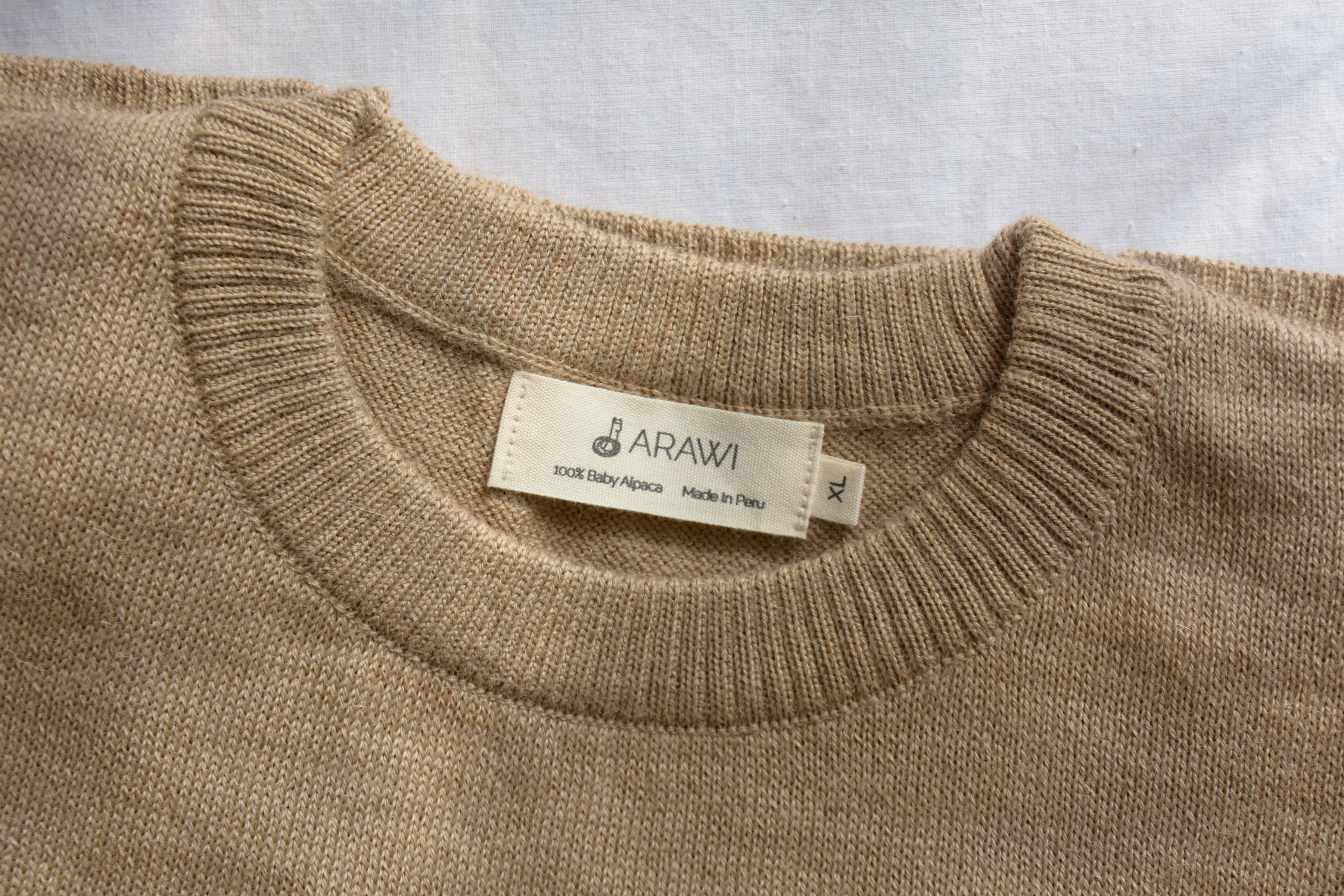 Alpaca_wool_clothes_in_Peru_beige_colored