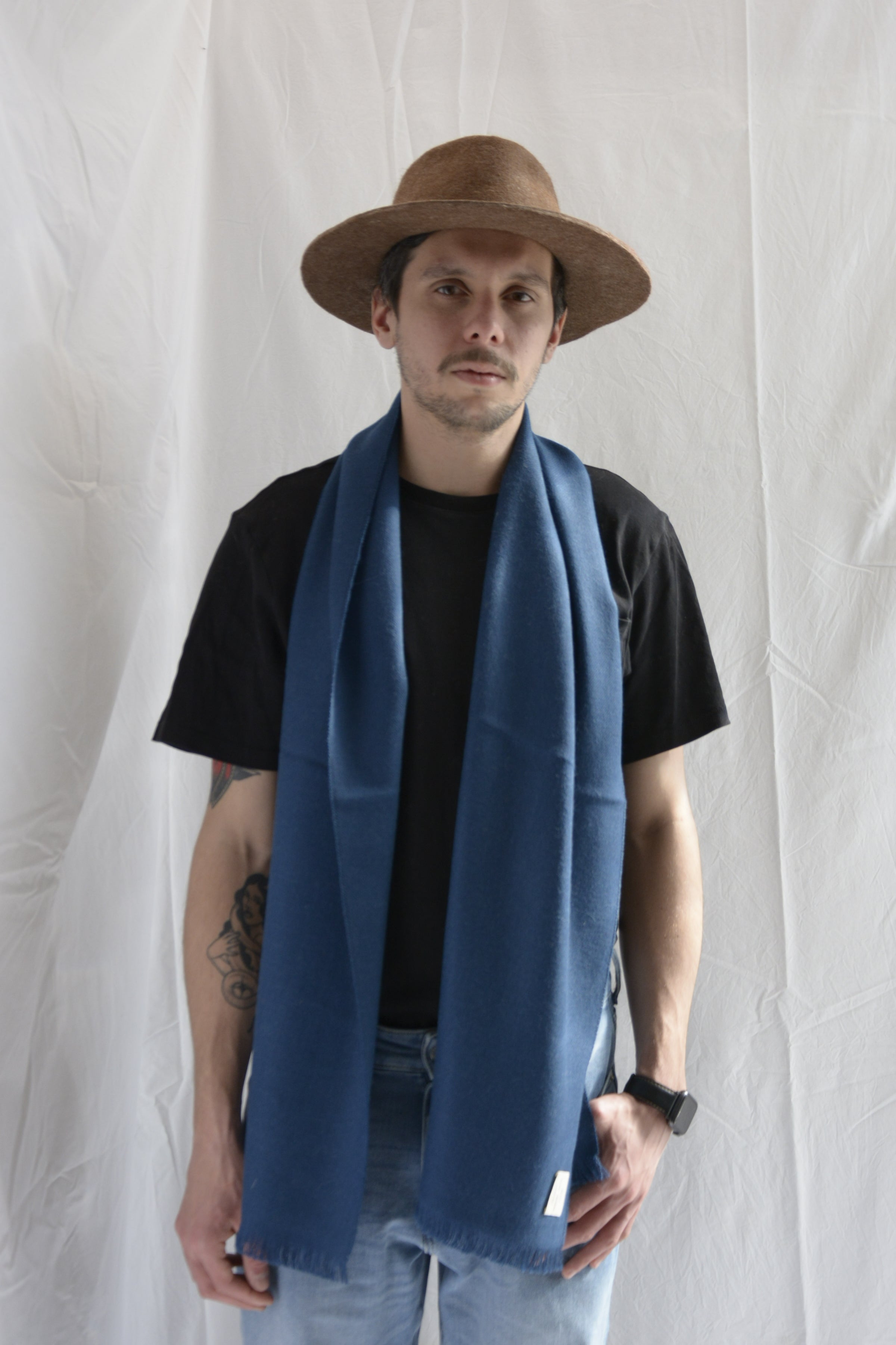 Man_wearing_brown_hat_and_blue_scarf_in_Peru