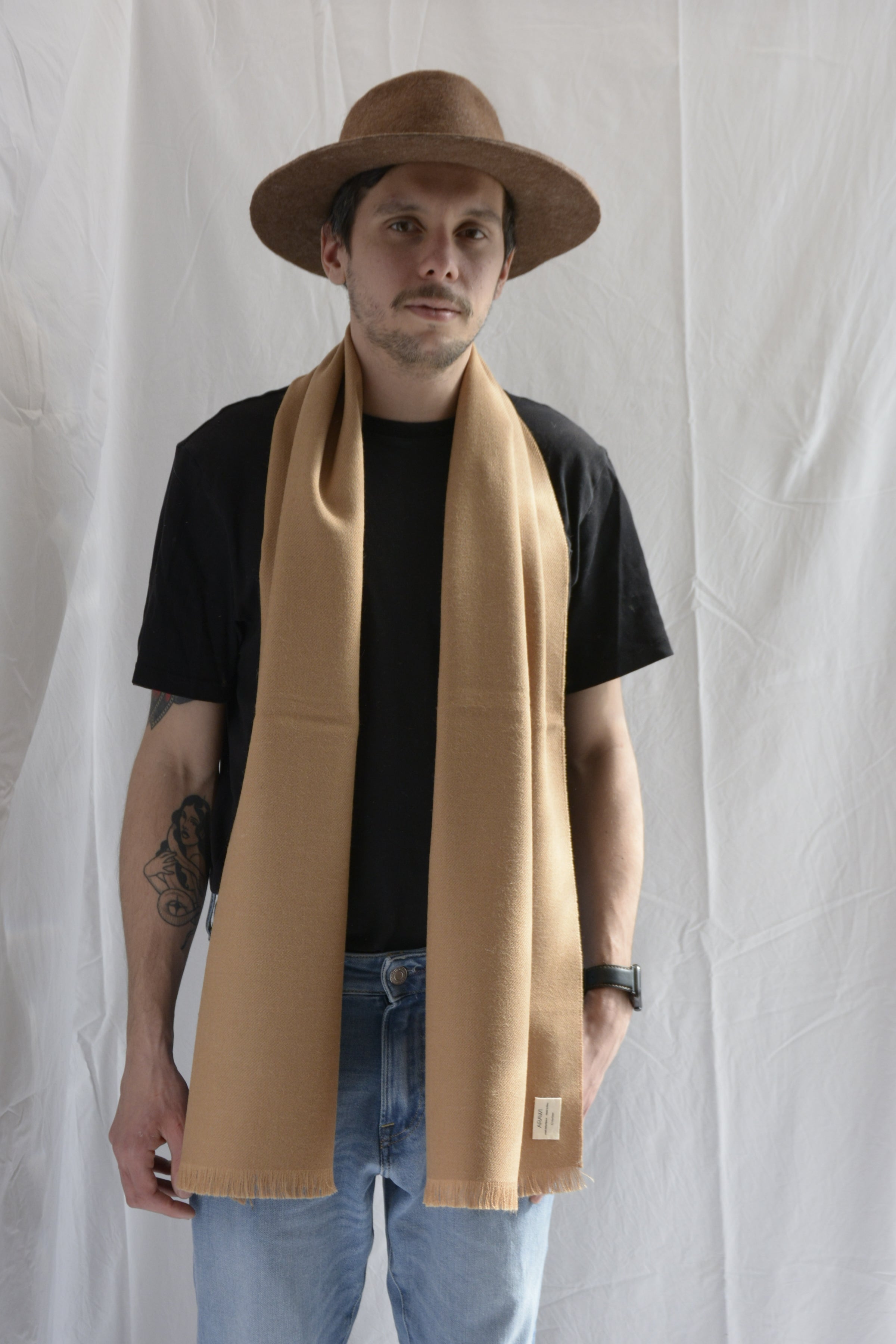 Man_wearing_brown_hat_and_yellow_scarf_in_Peru
