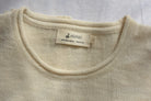Alpaca_wool_woman_clothes_cream_colored