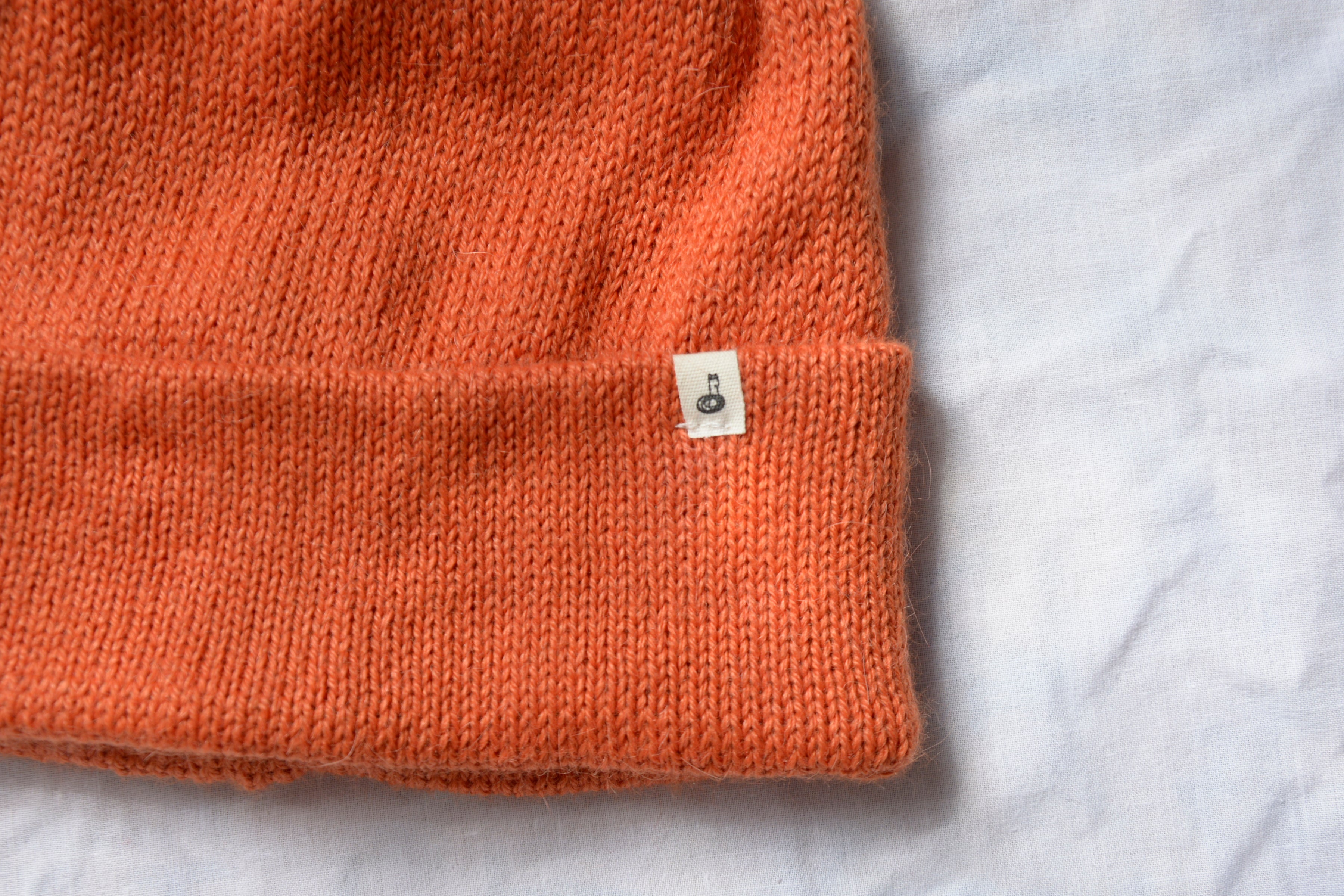 Orange_beanie_closer_with_logo