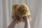 Brown_and_cream_slippers_feet_point_up